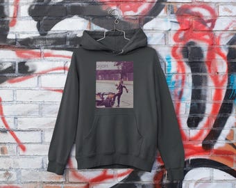 May include: A dark gray hooded sweatshirt with a graphic print of a person riding a motorcycle. The graphic is in a vintage style and features the text "Bijan".