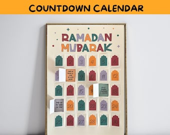 May include: A colorful Ramadan countdown calendar with the words "Ramadan Mubarak" in a decorative font. The calendar has 30 numbered flaps that can be opened each day to reveal a different activity or task.