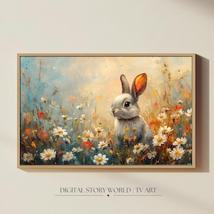 May include: A white rabbit with orange ears sits in a field of white daisies and other wildflowers. The rabbit is looking to the left of the image. The background is a soft blue and green.