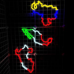 May include: A grid with neon outlines of different countries in yellow, blue, green, and red.