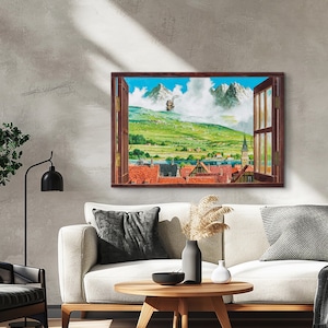 May include: A painting of a window with a view of a small town nestled in a valley with mountains in the background. The window is open and the view is framed by the window frame. The town is made up of small houses with red roofs and there is a lake in the valley. The mountains are covered in snow and there is a cloud in the sky.