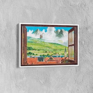 May include: A framed print of a window view with a mountain range in the distance, a small town in the foreground, and a flying machine in the sky. The window is open and the view is framed by a wooden window frame.