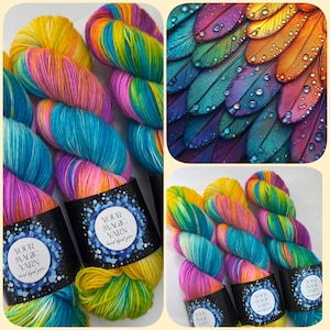 May include: Hand-dyed yarn skeins in bright colours of yellow, pink, blue, and green. Each skein is labelled with "YOUR MAGIC YARN hand dyed yarn". The image also includes a close-up of colourful feathers with water droplets.