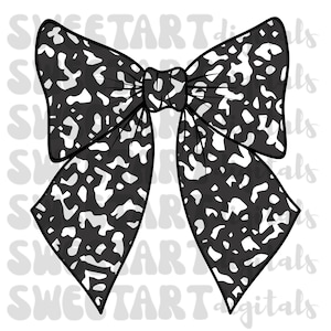 May include: A black and white bow with a leopard print pattern. The bow is tied in a knot and has two long tails.