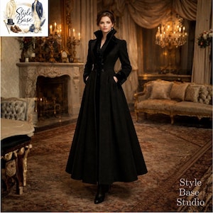 May include: A long, black coat with a high collar and velvet trim. The coat features a button-down front, pockets, and a flared skirt. The image is set in a room with a fireplace, chandelier, and antique furniture. The coat is a vintage style.