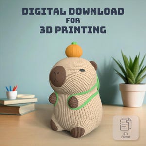 May include: A 3D printed model of a capybara wearing a green scarf and carrying a small orange pumpkin on its head. The model is beige with brown accents and is available for digital download in STL format.