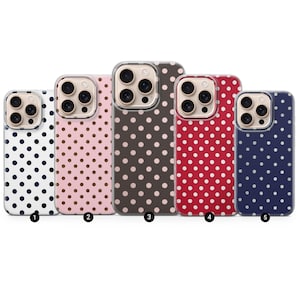May include: Five phone cases with a polka dot pattern in various colors: white with navy dots, pink with brown dots, brown with pink dots, red with white dots, and navy with white dots. Each case has a clear border.