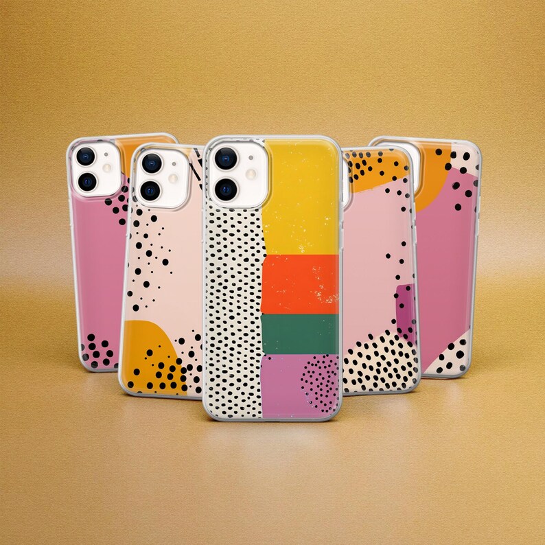 May include: Five clear phone cases with colorful geometric patterns. The cases are designed for an iPhone and feature a variety of shapes and colors, including pink, yellow, black, and green.
