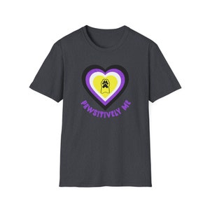 May include: A dark heather grey t-shirt with a purple, yellow, and white heart with a paw print inside. The text "Pawsitively Me" is printed below the heart.