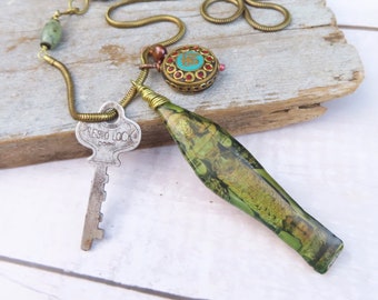 Long Brass Layering Necklace with Goddess, Key, and Ohm Pendants