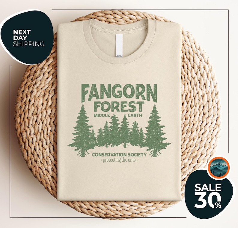 a t - shirt with a forest scene on it