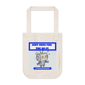 May include: Cream-coloured tote bag featuring a cartoon robot. The robot is grey with yellow eyes and a blue outline. The text "JUST HERE FOR THE WI-FI" is displayed above the robot.