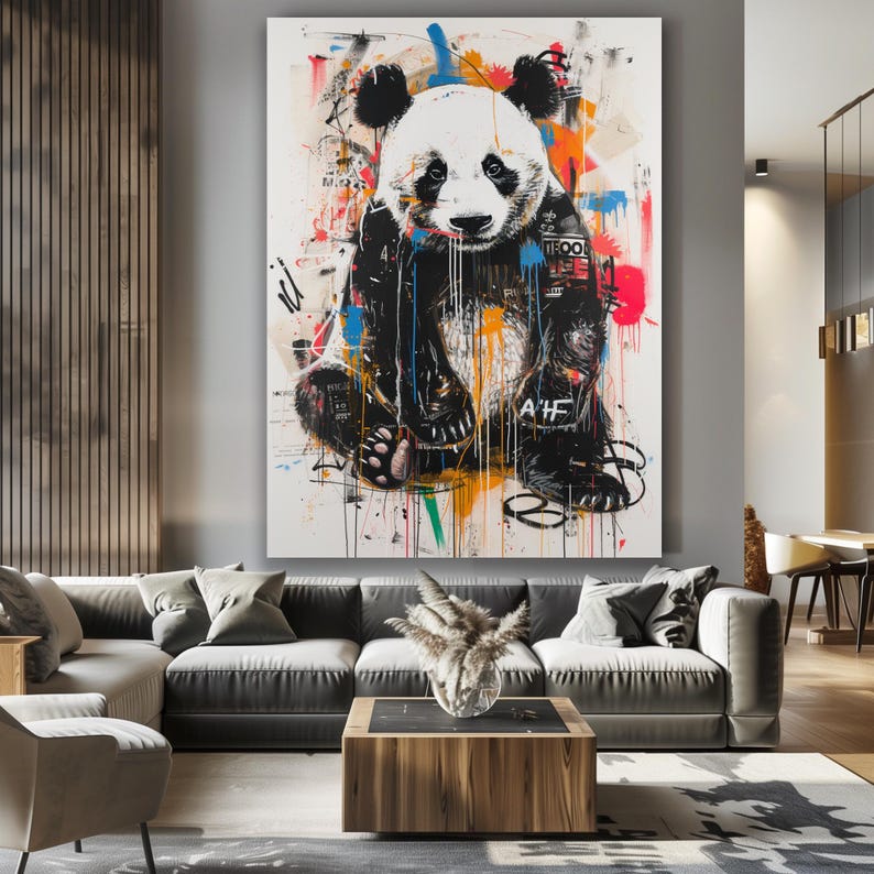 May include: A colourful abstract painting of a panda bear with black and white fur. The panda is sitting down with its paws in front of it. The background is white with splashes of colour, including blue, green, orange, and red.