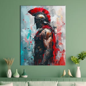 May include: Abstract art print of a Spartan warrior in profile. The artwork features a red plumed helmet, a red cape, and armor. The background has splashes of red, blue, and white paint, creating a dynamic and powerful image.