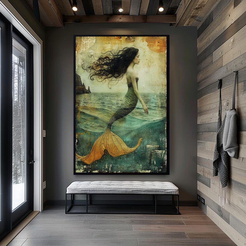 May include: A vintage-style painting of a mermaid with long flowing dark hair and a green tail. The mermaid is swimming in a turquoise ocean with a rocky cliff in the background. The painting has a distressed, textured look.