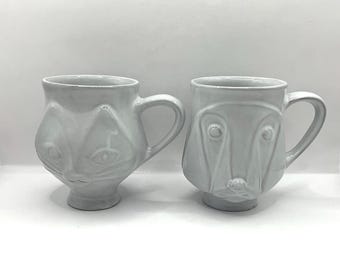 Tazas de la colección Utopia de Jonathan Adler con diseños de perros y gatos.