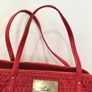 May include: A set of three ceramic vases in varying heights. The vases are white with a textured, ribbed design. The tallest vase is approximately 10 inches tall, the medium vase is 8 inches, and the smallest is 6 inches.