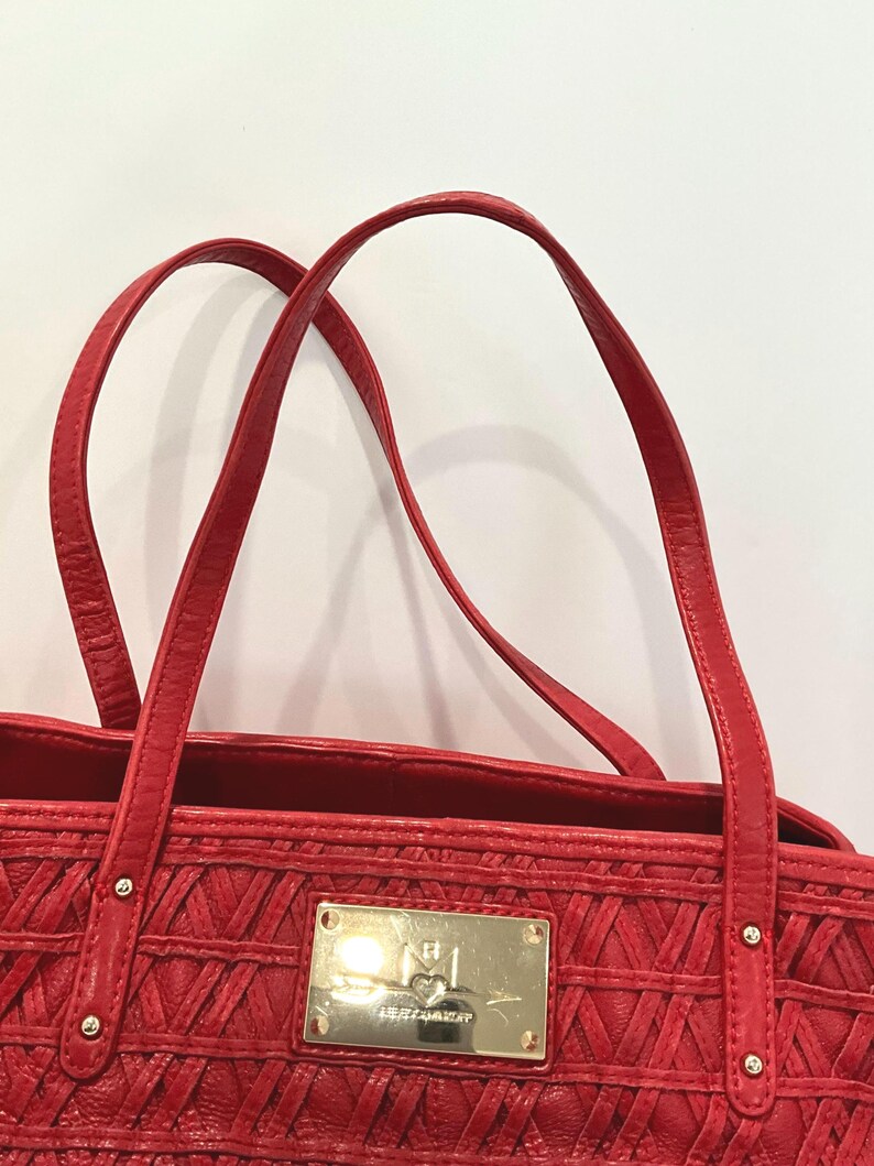 May include: A set of three ceramic vases in varying heights. The vases are white with a textured, ribbed design. The tallest vase is approximately 10 inches tall, the medium vase is 8 inches, and the smallest is 6 inches.