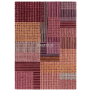 May include: Rectangular rug with a geometric design. The rug has a patchwork pattern with burgundy, pink, peach, and grey blocks. The pattern is made up of vertical and horizontal lines, giving it a textured look. The rug has the text "KAMTA O".