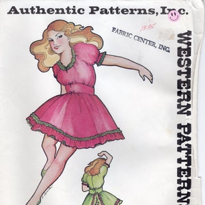 May include: A vintage sewing pattern for a dress with a ruffled skirt. The pattern is for a girl's dress and includes two different styles. The pattern number is 261. The pattern is from Western Patterns, Inc.