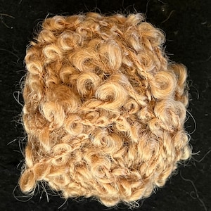 Bumpy doll hair. Light Brown colored.