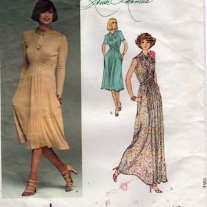 May include: Vintage Vogue French Boutique sewing pattern featuring three dress designs. The pattern includes a long-sleeved dress, a short-sleeved dress, and a floral print maxi dress. The pattern number is 1418.