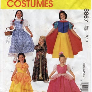May include: McCall's Costumes pattern featuring children's dress designs. The pattern includes designs for a Dorothy dress, Snow White dress, a princess dress, and other costumes. The pattern size is 8, 10.