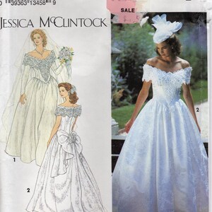 May include: Simplicity pattern 8165 by Jessica McClintock. The package features illustrations and a photograph of a white wedding dress with lace detailing. The dress has an off-the-shoulder neckline and a full skirt. The pattern includes sizes 12-16.