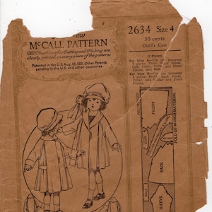 May include: Vintage McCall Pattern 2634 for a child's coat, size 4. The sepia-toned paper features illustrations of two children in coats, along with pattern pieces and instructions. The text includes "McCall Pattern" and "Patented in the U.S. Aug. 16, 1921."