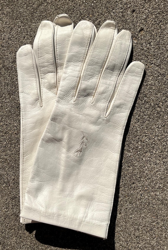 Post-WWII white leather gloves with embroidered flower. Tags Attached