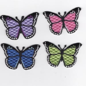 Embroidered and textured butterfly patches, appliques. Black and colors. Iron-on