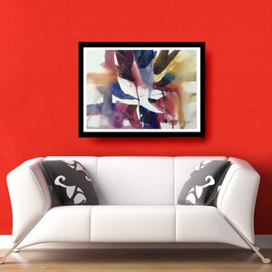 May include: Abstract watercolour painting in shades of purple, blue, brown, and white. The painting features a large, central leaf-like shape with smaller shapes surrounding it. The painting is framed in a black frame and is hanging on a red wall.