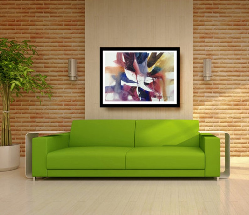 May include: A green sofa with a framed abstract watercolour painting above it. The painting features a mix of purple, blue, yellow, and red colours.
