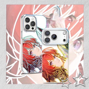 May include: Clear phone cases with a vibrant anime-style illustration of a woman with red hair and purple eyes. The design features intricate line art and a soft color palette, creating a stylish accessory.
