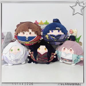 May include: A collection of five plush dolls with round bodies and detailed facial features. Each doll has a unique hairstyle and outfit, with colors including brown, blue, purple, white, and black. The dolls are arranged closely together, showcasing their varied designs.