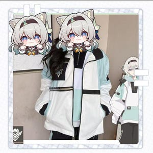 May include: A white, black, and light blue jacket with a black zipper and a small butterfly design. The jacket has a color block design and is paired with black pants. The image also includes a cartoon character with cat ears.