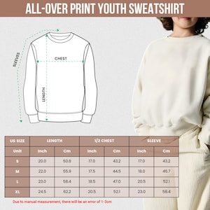 May include: Cream-colored youth sweatshirt with a crew neck. The image includes a size chart with measurements in inches and centimeters for length, chest, and sleeve sizes, ranging from S to XL. The text "ALL-OVER PRINT YOUTH SWEATSHIRT" is at the top.