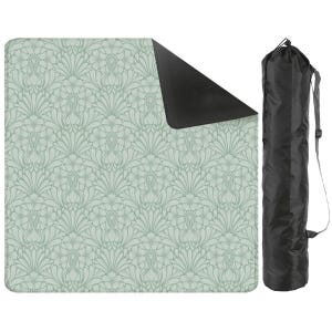 May include: A square outdoor blanket featuring a light sage green damask pattern on one side and a solid black underside, accompanied by a matching black cylindrical carrying bag with an adjustable shoulder strap for transport and storage.