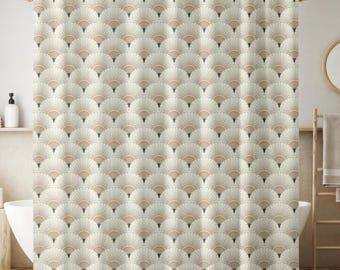 May include: A beige and white shower curtain with a repeating fan-shaped pattern. The design features a series of overlapping, stylized fans in shades of beige, cream, and gray, creating a textured, art deco-inspired look. The curtain hangs from a gold-colored rod.