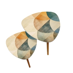 May include: Two side tables with a unique design. The tabletops feature a watercolor pattern of geometric shapes in shades of beige, orange, blue, and green. Each table has three wooden legs.