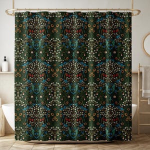 May include: Dark green shower curtain with a repeating floral pattern. The design features white, red, blue, and yellow flowers and leaves. The curtain is hanging from a gold-colored rod.
