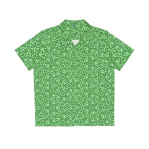 May include: A green short-sleeved button-down shirt with a geometric pattern.