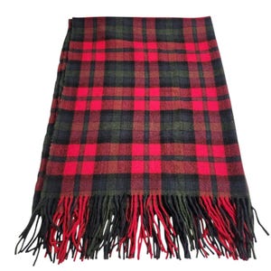 May include: A red, black, and green tartan scarf with fringed edges. The scarf displays a traditional plaid design, with a vibrant red as the primary colour, contrasted by black and green. The fringing at the ends is a mix of red and black.
