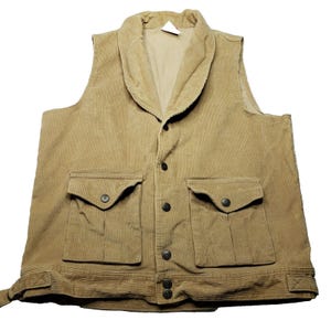 May include: A brown corduroy vest with a shawl collar, two large pockets, and a button front closure.