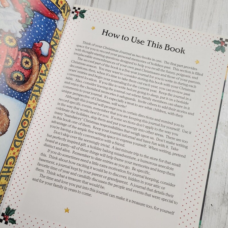 May include: A book titled "How to Use This Book" with a red and white star design on the cover. The book is open to a page with instructions on how to use a Christmas journal.
