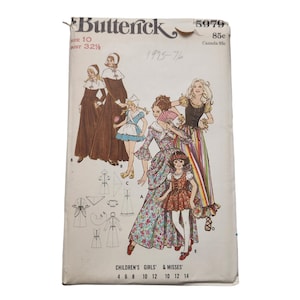 May include: Vintage sewing pattern for a women's and children's dress. The pattern is from Butterick and is number 5979. The pattern includes instructions for sizes 4-14.