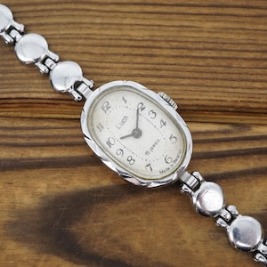 Vintage women&#39;s Luch 1801.1 mechanical wristwatch timepiece with classic manual wind watch