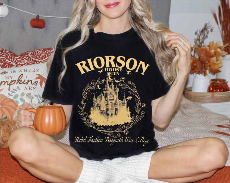 a woman sitting on a bed holding a pumpkin