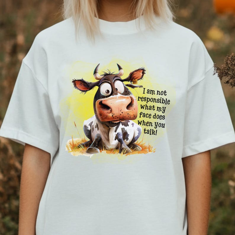 May include: White t-shirt with a cartoon cow illustration and the text "I am not responsible what my face does when you talk!"
