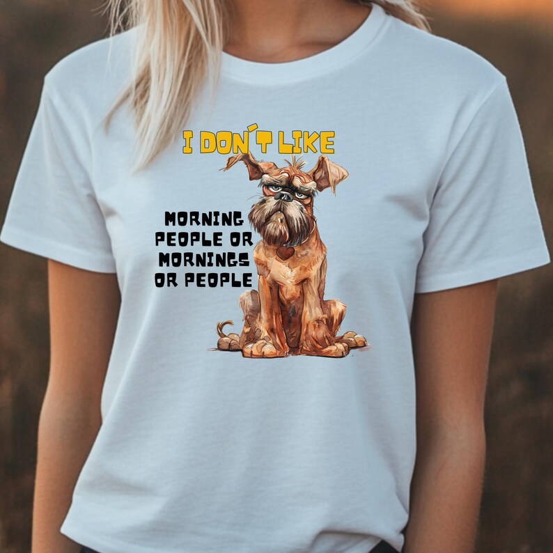 May include: White t-shirt featuring a cartoon dog wearing glasses and the text "I don't like morning people or mornings or people".